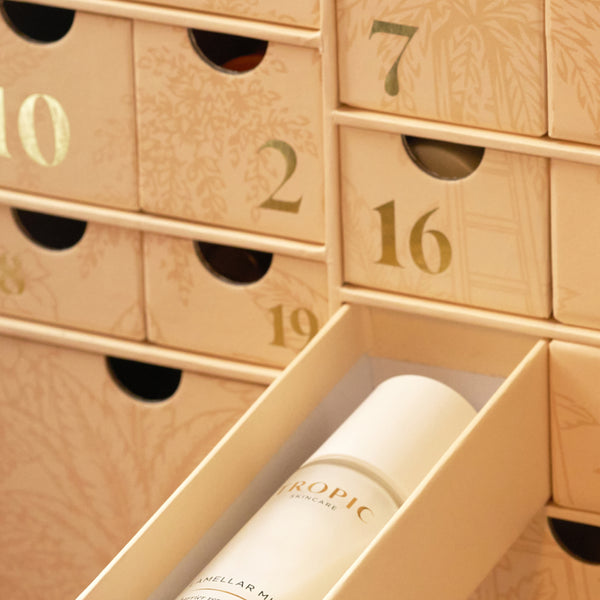 Close-up of Tropic advent calendar drawer pulled open revealing a Lamellar Micellar toner inside.