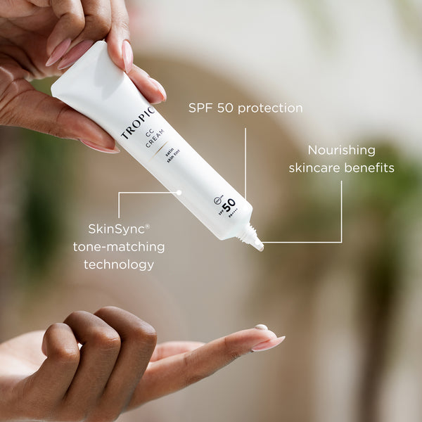 Tropical C-Cream tube held by a hand with text highlighting features