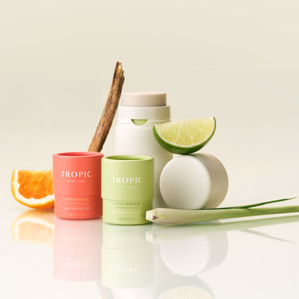Tropic Confidence deodorant refills in Blood Orange & Cedar and Gingergrass & Lime displayed with natural ingredients.