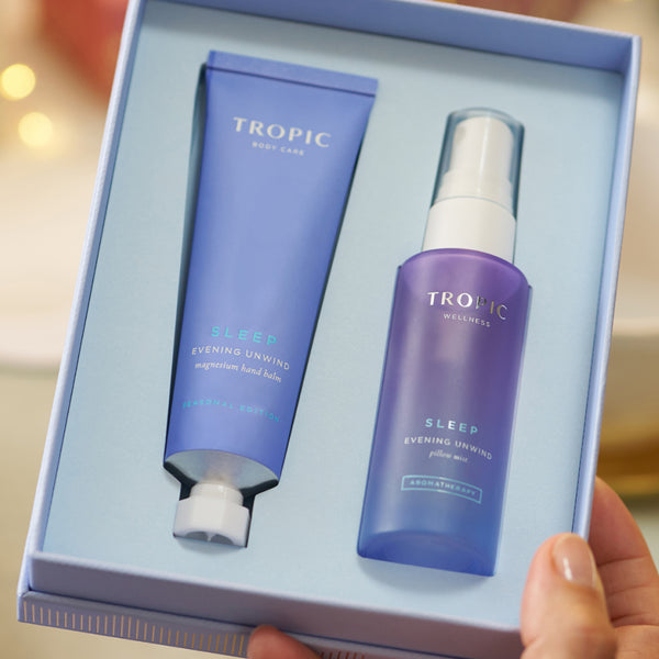 Tropic Dream Team Collection open gift box showing Sleep Evening Unwind magnesium hand balm and pillow mist.