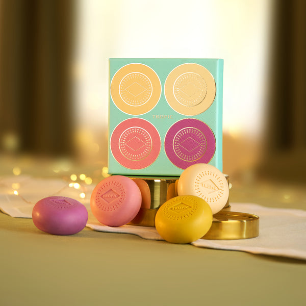 Tropic solid soap gift set in four colours with mint green gift box and gold tin with fairy lights.