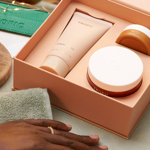 Tropic gift set open box containing Mineral Milk, body balm and Deep Recovery Magnesium Balm.