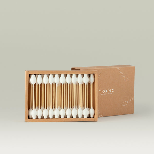 Open box of Tropic Bamboo Buds containing 31 bamboo cotton swabs, with the lid partially visible in the background.