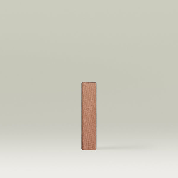 Single rectangular Tropic “Eyes On You” eyeshadow pan in the shade Maca, shown upright against a soft neutral background. 
