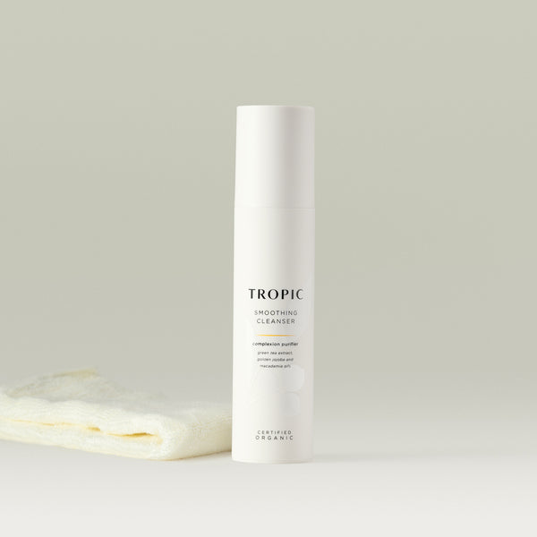 Tropic Smoothing Cleanser complexion purifier 120ml with bamboo face cloth.
Contains green tea extract, golden jojoba and macadamia oils. Certified Organic. White tube with white lid. Leaf design features behind black text.