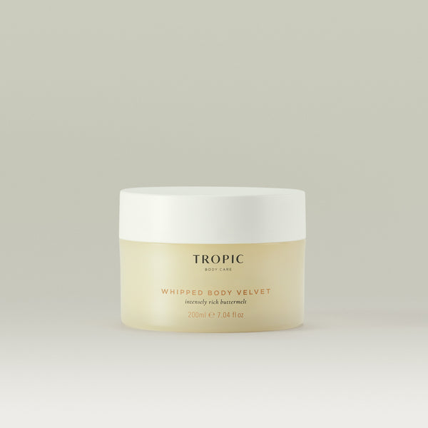 Tropic Whipped Body Velvet body butter in a cream jar with a white lid against a neutral background.